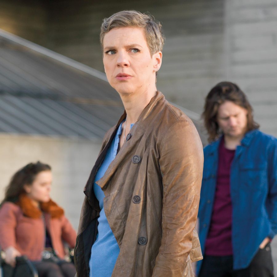 all-of-us-francesca-martinez-photo-laura-pannack-Tall-Masthead All of Us - photo of Francesca Martinez in an urban setting, with two cast members, out of focus, behind her