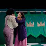 Laertes and Ophelia are holding each other whilst looking upset.