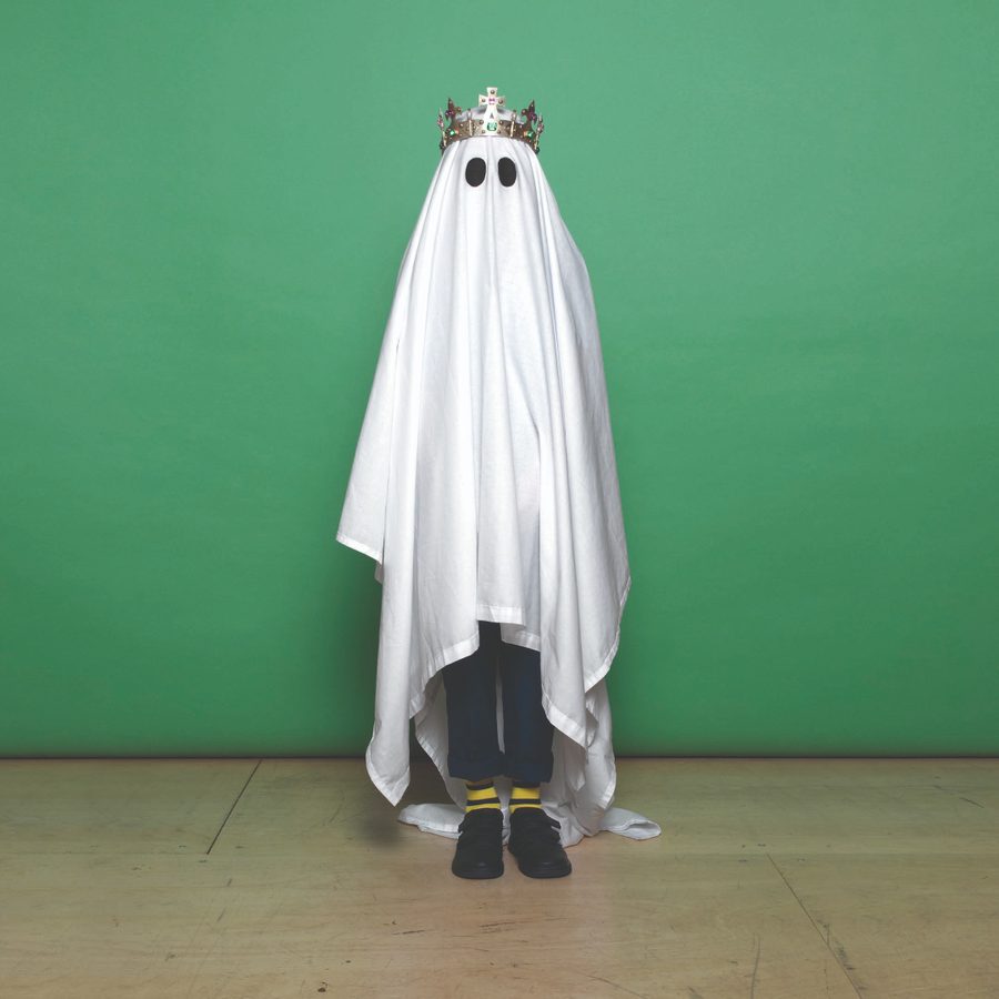 hamlet-primary-shakespeare-2000x1000 Hamlet - a figure wearing a white sheet with black circles for eyes, like a ghost, and a gold crown.
