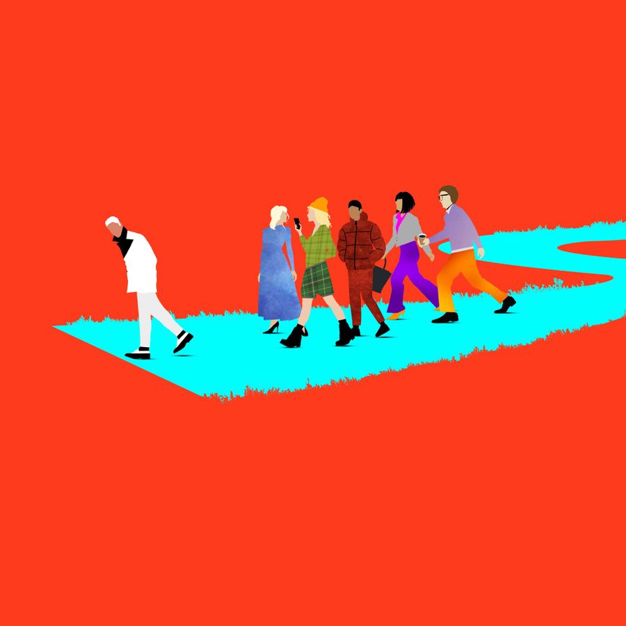 Here-We-Are-National-Theatre-2000x1000 A minimalist illustration showing six people walking on a turquoise path. A man in white walks ahead alone, while a group of five people in colorful outfits follows behind. The background is a solid bright red.