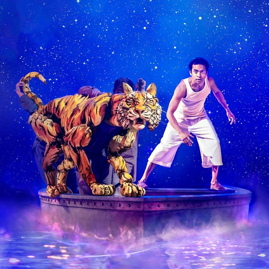 An animated image of a tiger and an actor playing the character of Pi Patel