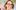 LucyCleveley-2000x1250 A photograph of a woman with a blonde bob wearing glasses and smiling