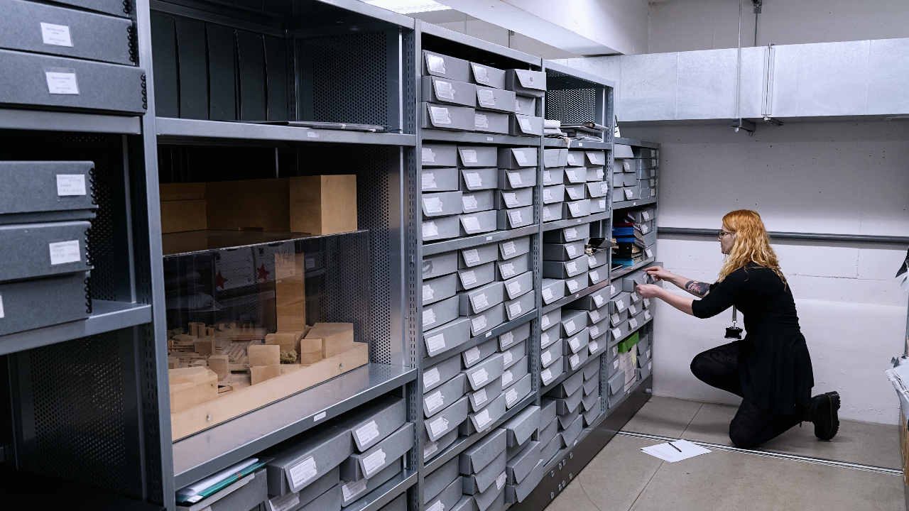 NTArchive-bluedrawerpullout Somebody opening a blue archive drawer