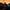 The-Odyssey-Episode-1-mobile-2000x2000 A group of people dancing around a golden shaft of light leading upwards to a three-chimney building on a hill with a fire harnessed inside