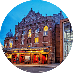 theatre-royal-wakefield-507x507 The front of the Theatre Royal Wakefiled building, a red-brick facade with a glass canopy projecting over the entrance.
